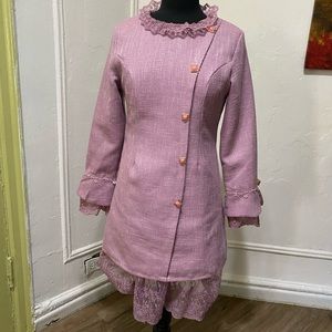 pink tweed two-piece skirt suit in one peace.